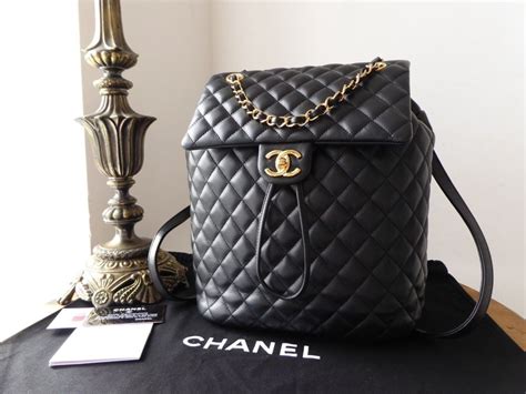 chanel backpack urban gold hardware|Chanel black and white handbags.